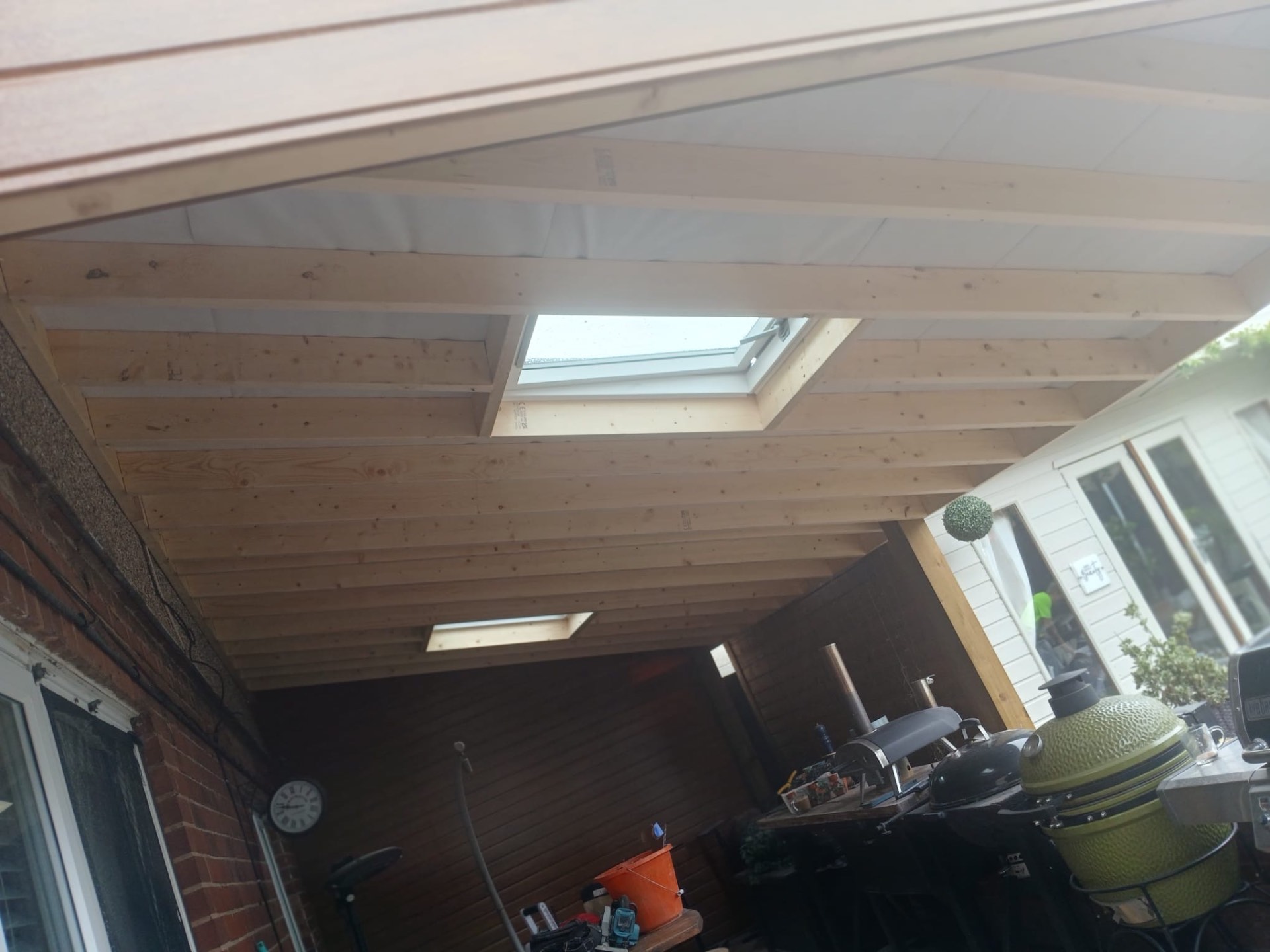 Inside view of a finished timber canopy ceiling with skylights