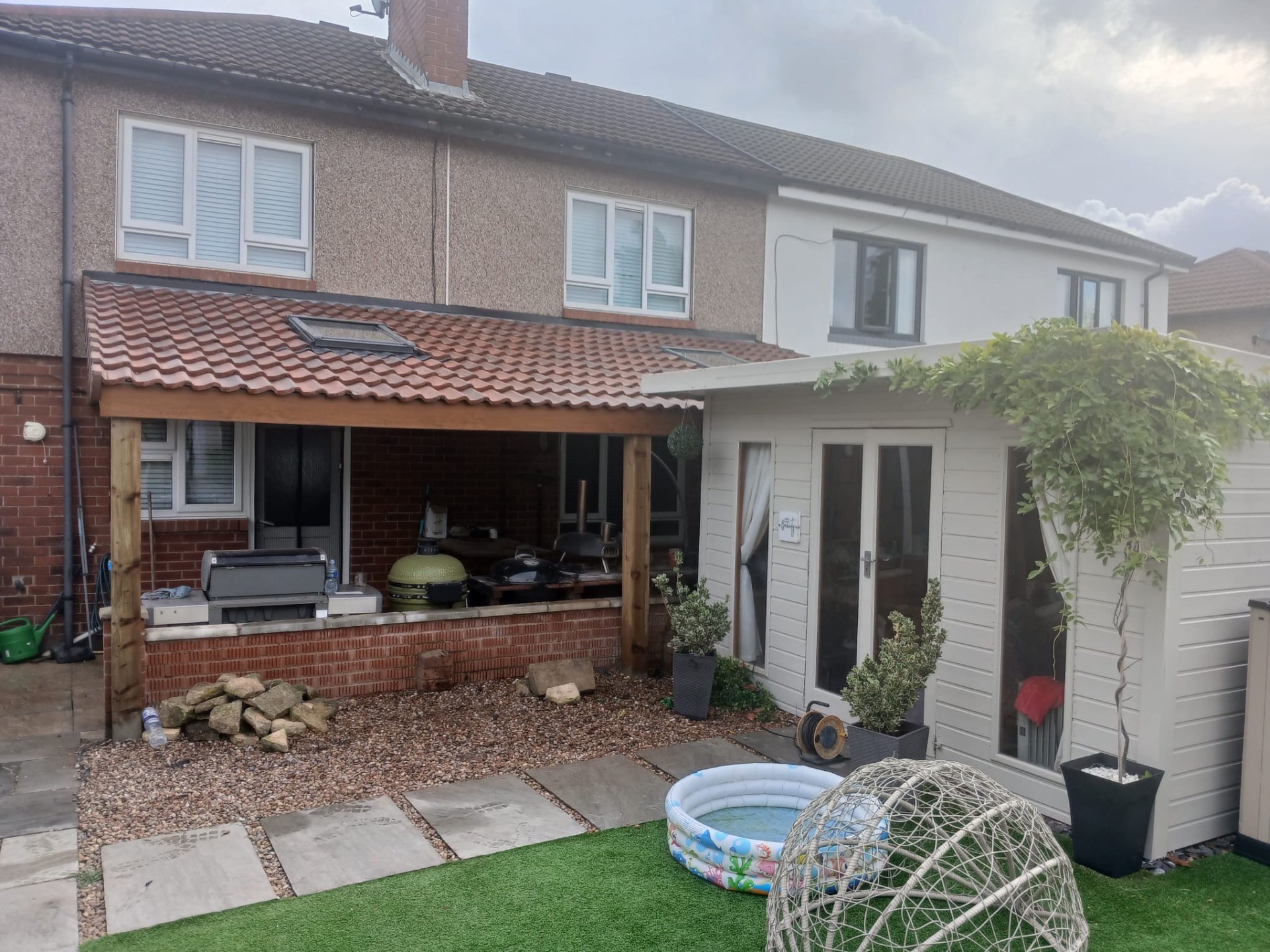 Completed rear garden canopy, tiled roof and outdoor kitchen area