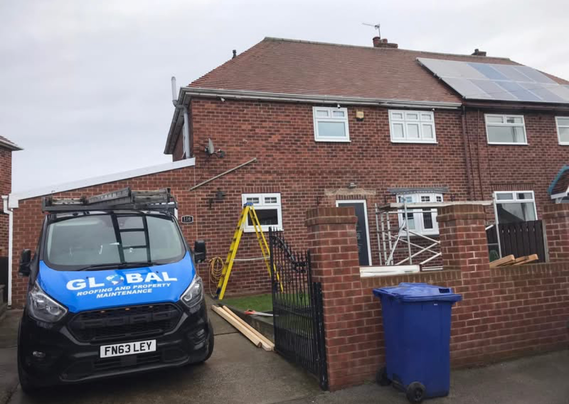 Global Roofing and Property Maintenance van parked outside a home project