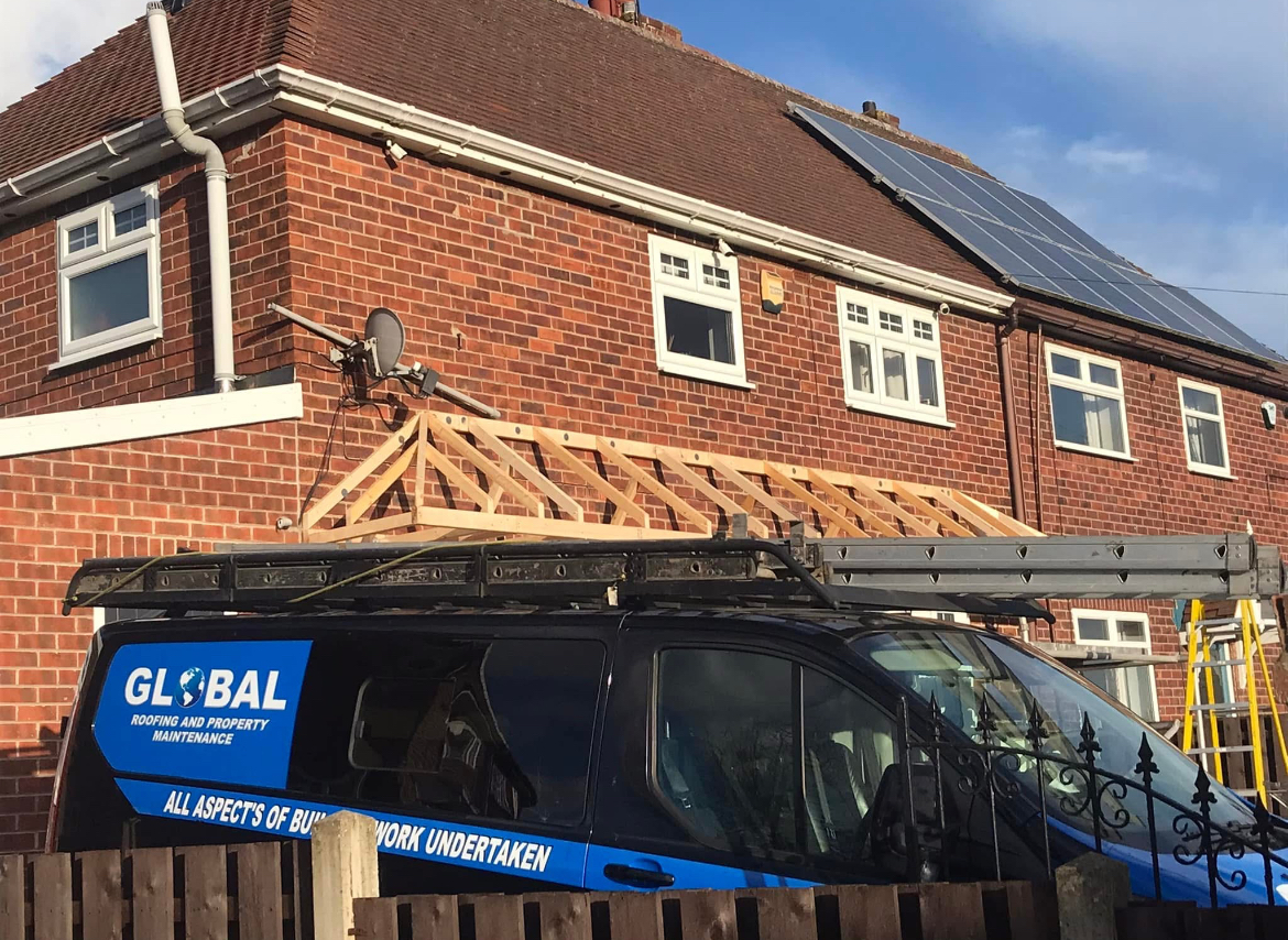 Global Roofing and Property Maintenance van parked outside an active canopy job